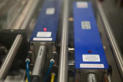 Blue gas lasers mounted on an optical table