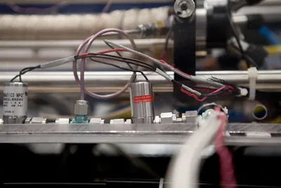 Pneumatic valves and wiring on an optical breadboard